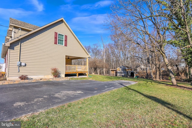 view of property exterior with a yard