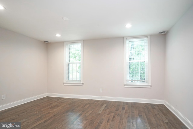 empty room featuring dark hardwood / wood-style floors