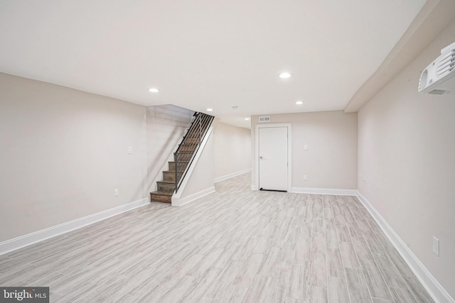 basement featuring light wood-type flooring