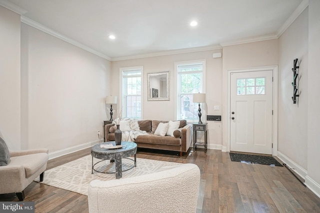 living room with dark hardwood / wood-style flooring and crown molding