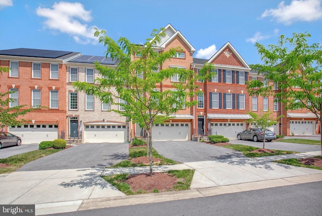 townhome / multi-family property featuring a garage