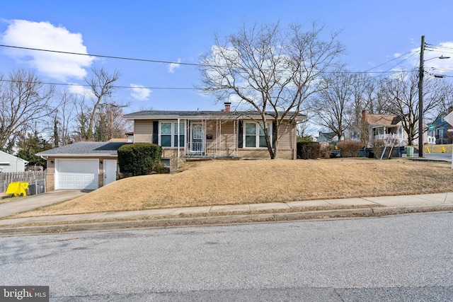 view of front of home with a garage, concrete driveway, brick siding, and a chimney