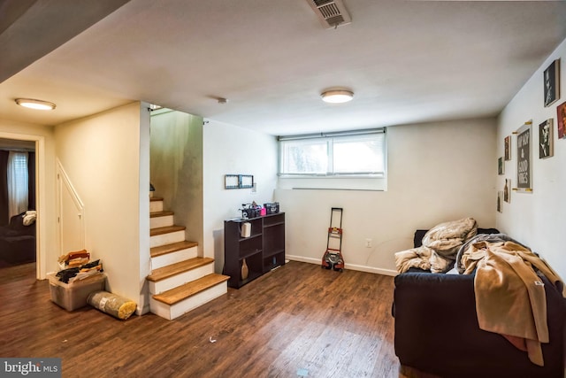 sitting room with baseboards, stairs, visible vents, and dark wood finished floors