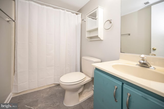 bathroom with vanity and toilet