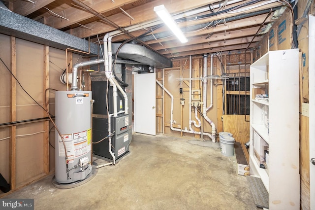 basement featuring gas water heater and heating unit