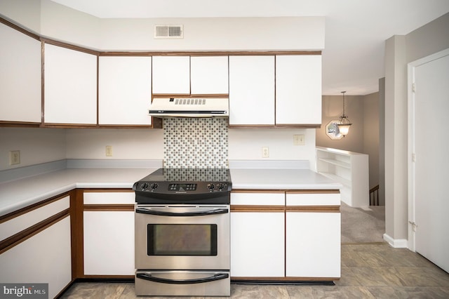 kitchen featuring electric stove, white cabinetry, kitchen peninsula, and pendant lighting