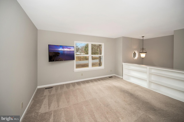 unfurnished living room with light carpet