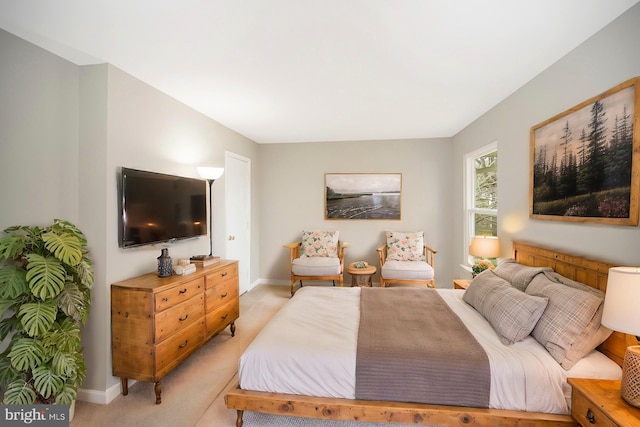 bedroom with light colored carpet