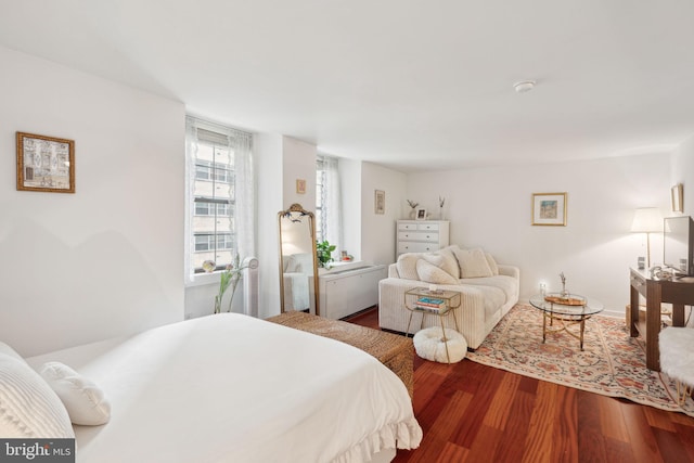 bedroom with hardwood / wood-style floors