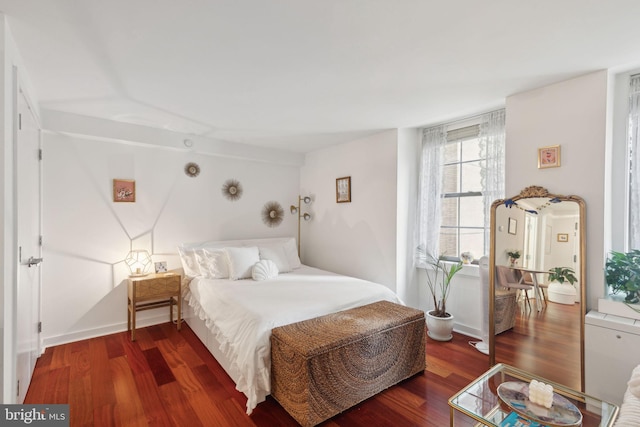 bedroom with wood-type flooring