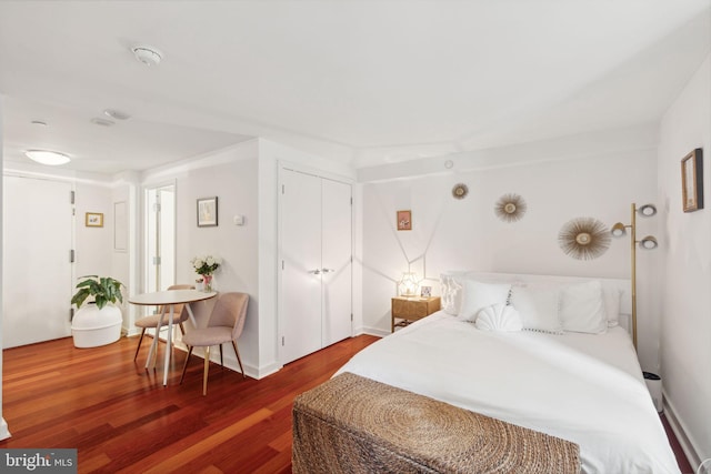 bedroom featuring dark hardwood / wood-style floors