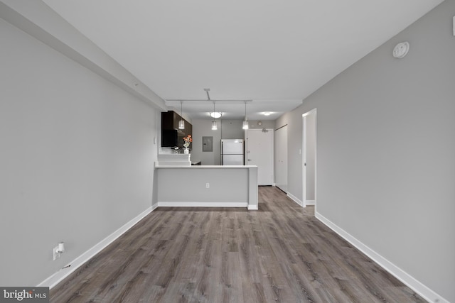 unfurnished living room featuring hardwood / wood-style flooring