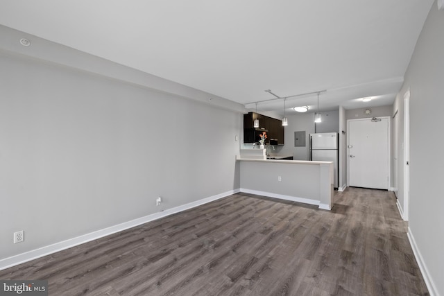 unfurnished living room with dark wood-type flooring