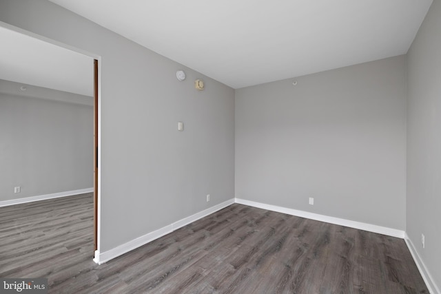 empty room featuring dark hardwood / wood-style floors