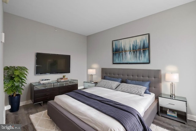 bedroom with wood-type flooring