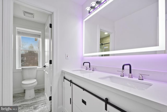 bathroom with vanity and toilet