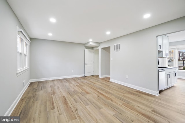 unfurnished living room featuring light hardwood / wood-style floors