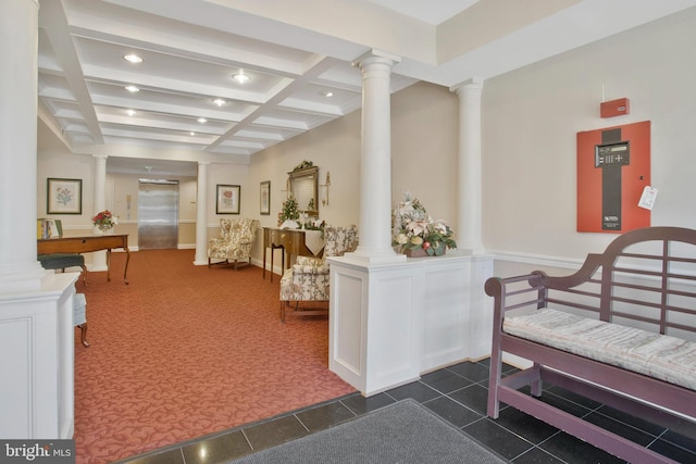 corridor with beam ceiling, elevator, dark carpet, and coffered ceiling