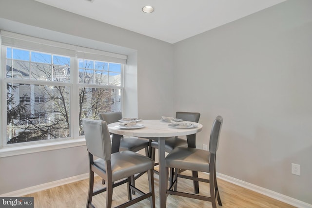 dining space featuring light hardwood / wood-style flooring