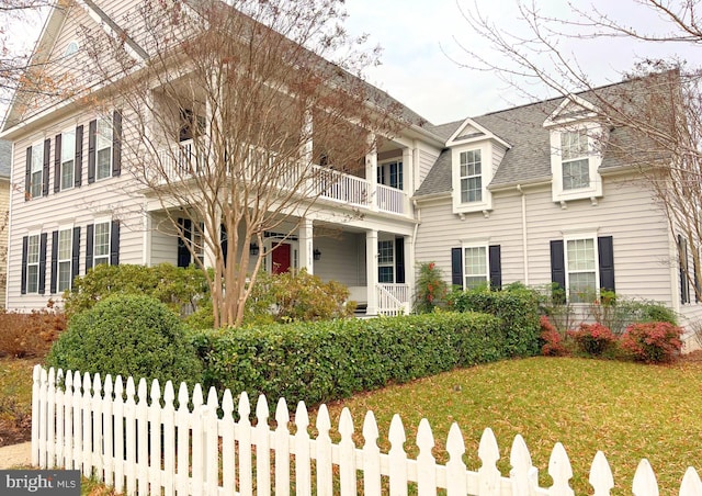 view of front of property with a balcony