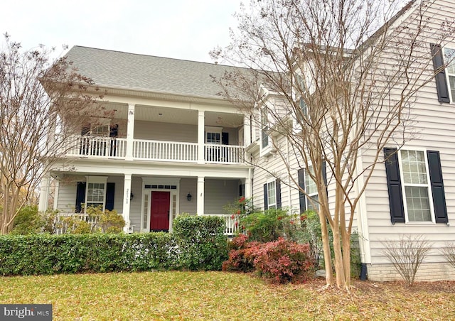 view of front of house featuring a balcony and a porch