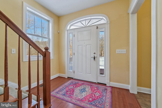 foyer with wood-type flooring