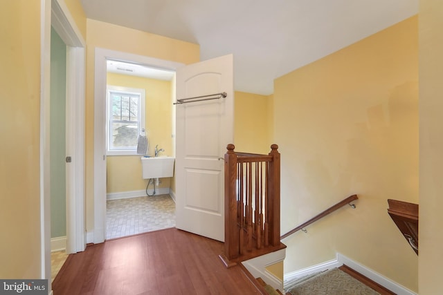 hallway with wood-type flooring