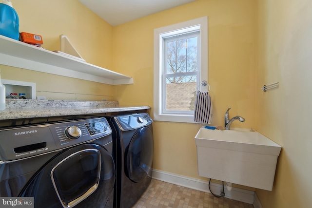 laundry room with sink and washing machine and clothes dryer