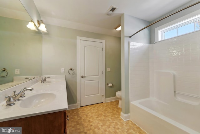 full bathroom featuring vanity, toilet, and washtub / shower combination