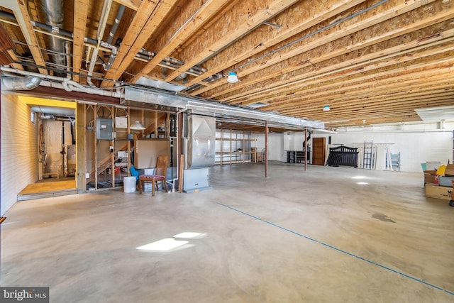 basement featuring electric panel