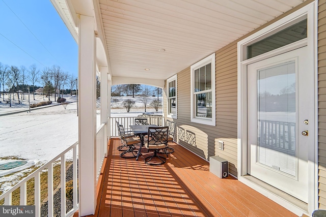 view of snow covered deck