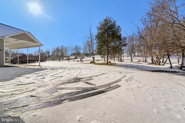 view of yard layered in snow