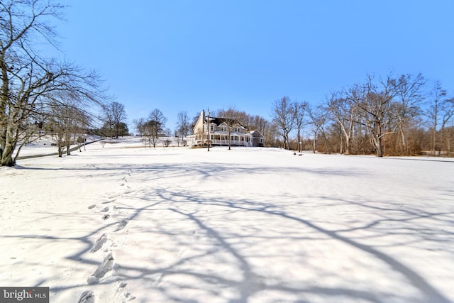 view of yard layered in snow