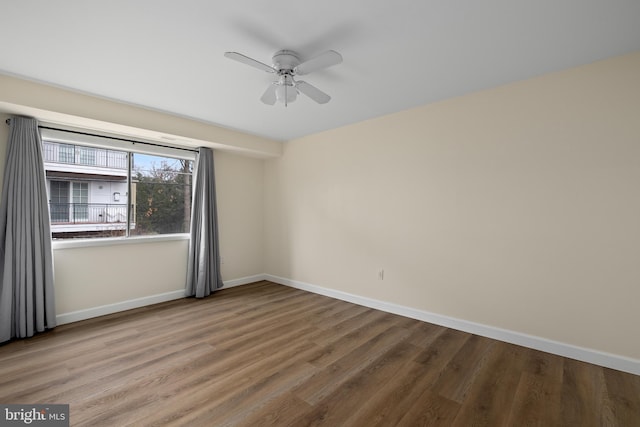 spare room with ceiling fan and hardwood / wood-style floors