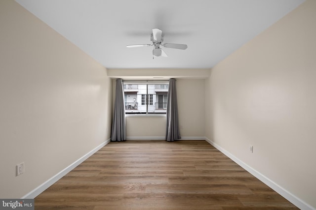 spare room with ceiling fan and hardwood / wood-style floors