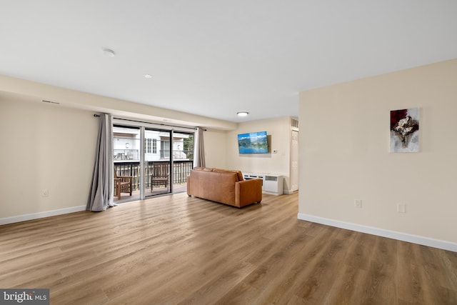 unfurnished living room with light hardwood / wood-style floors