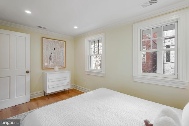 bedroom featuring wood-type flooring and crown molding