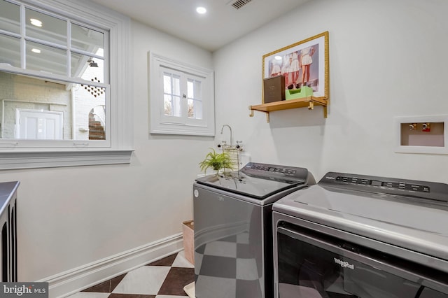 washroom featuring washer and dryer