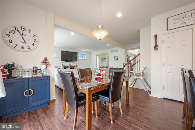 dining room with dark hardwood / wood-style floors