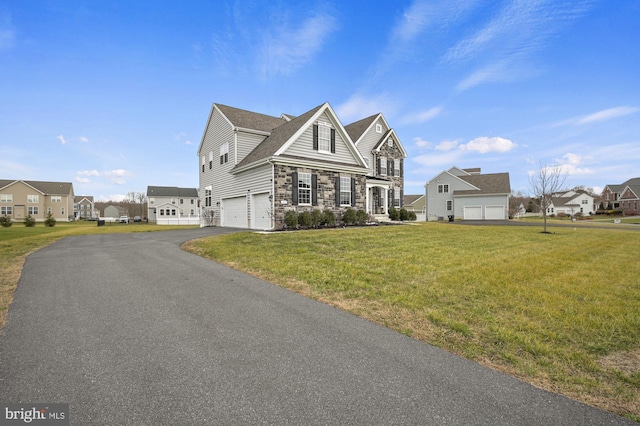 view of front property with a garage and a front lawn