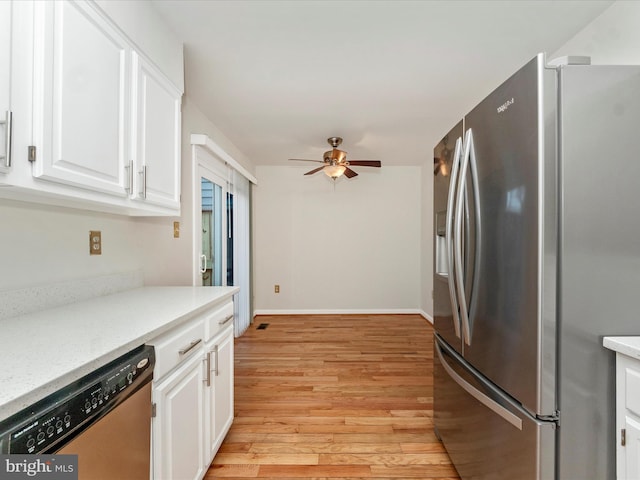 kitchen with white cabinetry, ceiling fan, light hardwood / wood-style floors, and appliances with stainless steel finishes