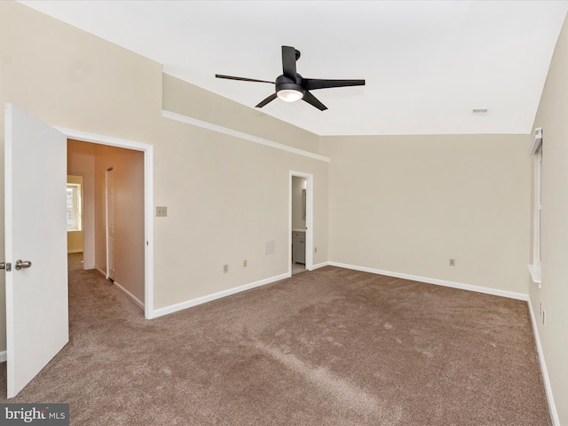 carpeted empty room featuring ceiling fan