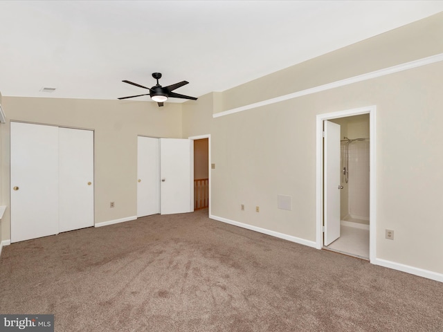 unfurnished bedroom with carpet, ceiling fan, and ensuite bath