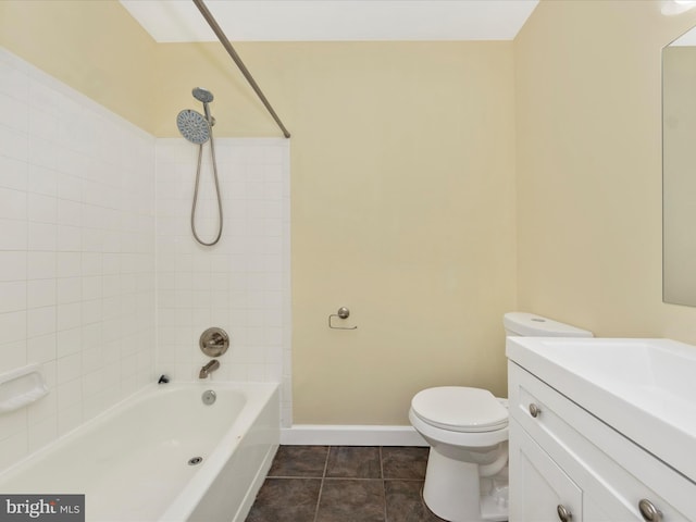 full bathroom with tile patterned flooring, tiled shower / bath combo, toilet, and vanity