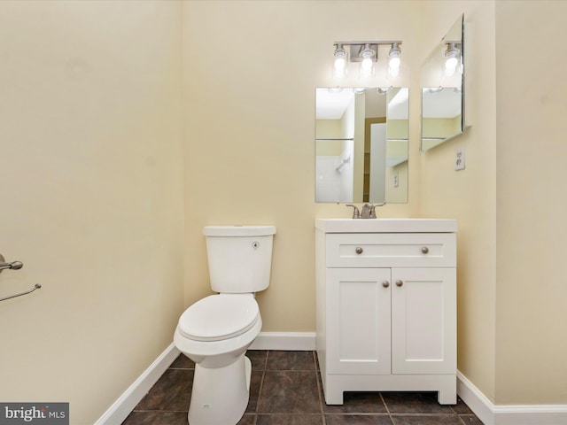 bathroom with walk in shower, vanity, and toilet