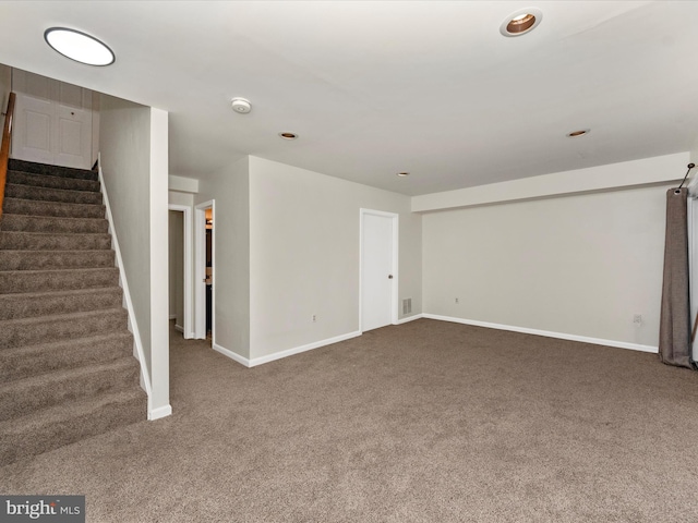 basement with dark colored carpet