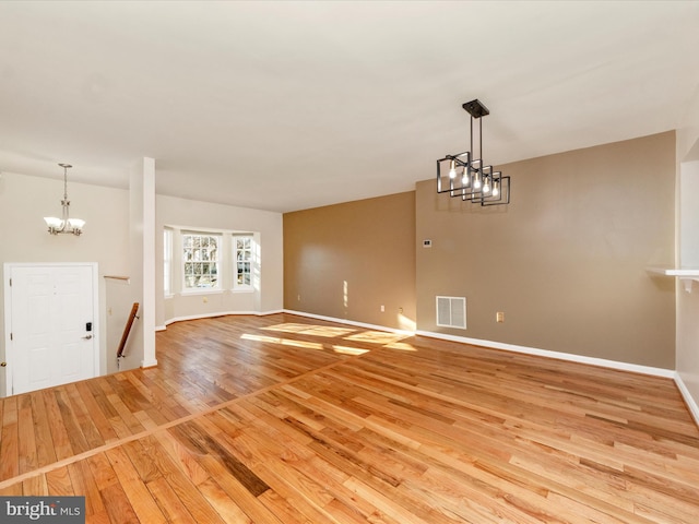 unfurnished living room featuring light hardwood / wood-style floors