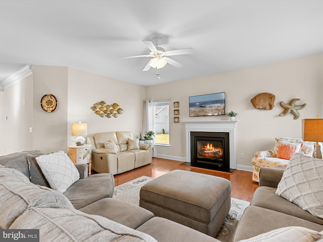 living room featuring light wood-type flooring and ceiling fan