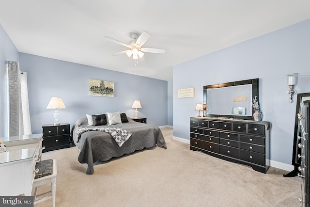 carpeted bedroom featuring ceiling fan