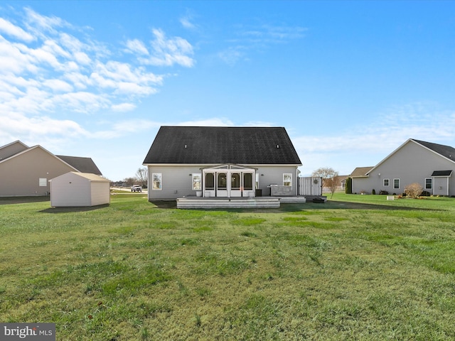 back of house with a yard and a deck